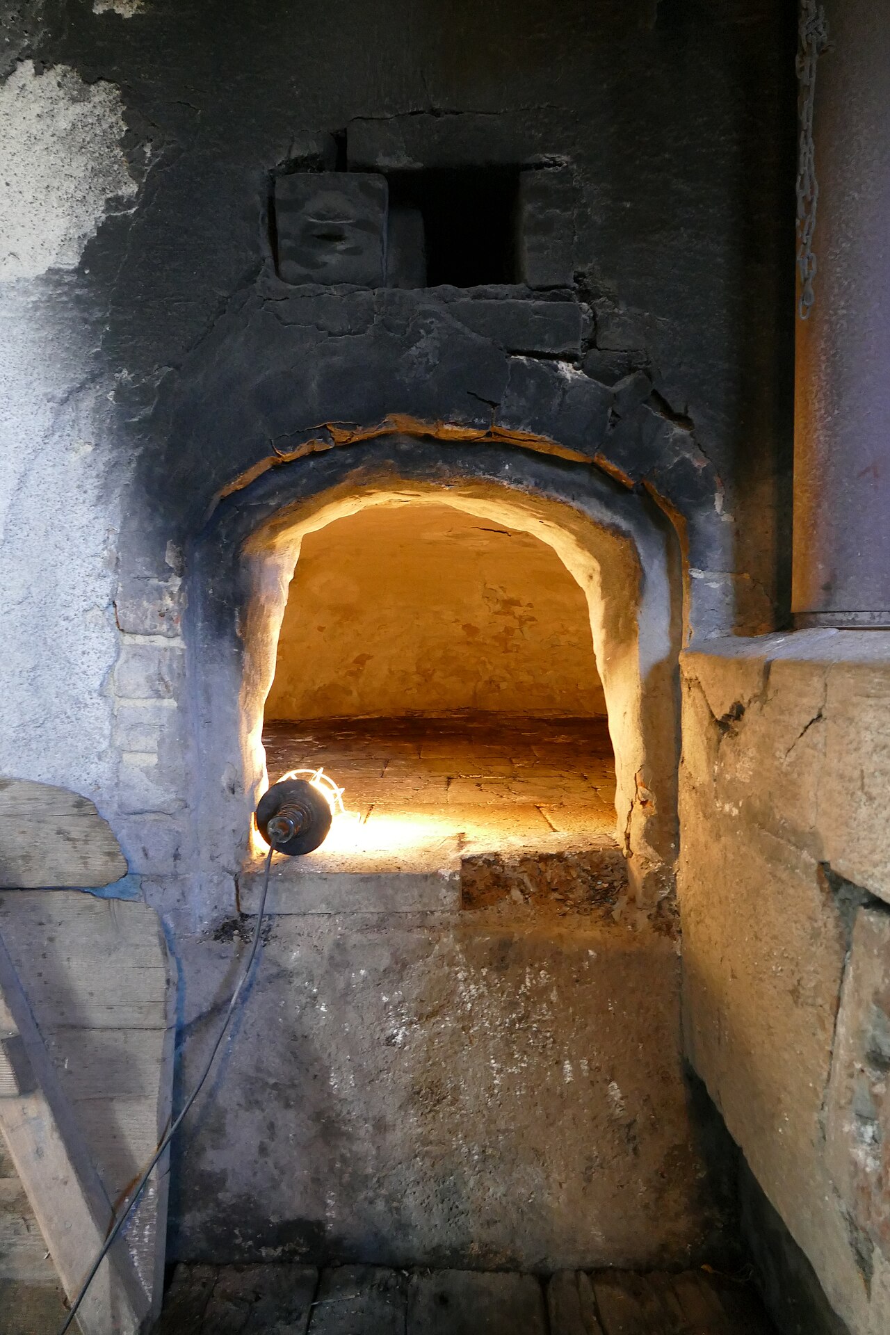 Glowing interior of a traditional bread oven at full firing temperature